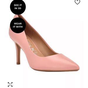 Brand new. Never worn. Calvin Klein Pumps. Pink 7
